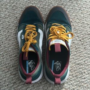 Red, green, and yellow vans